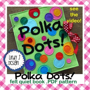Könnte beinhalten: Ein grünes Filz-Quiet-Book mit bunten Polka-Dots und den Worten "Polka Dots!" in Schwarz. Das Buch hat eine Spiralbindung und ein rot-weiß gepunktetes Band. Der Text "see the video!" ist ebenfalls sichtbar.