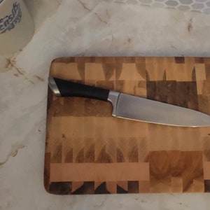 End Grain Maple butcher block cutting board with feet.