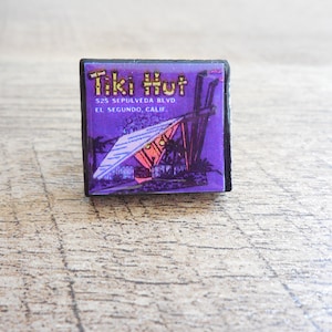 The Tiki Hut, Tiki Bar Tie pin/Lapel Pin! Black scrabble tile pin featuring favorite Tiki establishments, Tiki-culture, Tiki Oasis