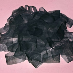 May include: A pile of black mesh ribbon, likely for crafting or decorating.
