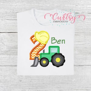 May include: A white t-shirt with a green tractor, an orange and yellow number 2 with a yellow hard hat on top, and the name "Ben" embroidered on it.