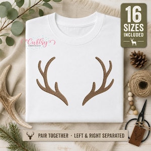 Puede incluir: Una camiseta blanca con un diseño de astas de ciervo bordado en color marrón en el centro. La prenda incluye el texto 16 SIZES INCLUDED y PAIR TOGETHER - LEFT & RIGHT SEPARATED. El diseño está centrado en la parte frontal de la camiseta.
