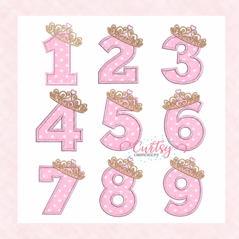 May include: A set of pink numbers from one to nine, each featuring a white polka dot pattern and a gold-colored crown with a small heart on top. The text Curtsy EMBROIDERY is visible in the center. Each number has a stitched border.