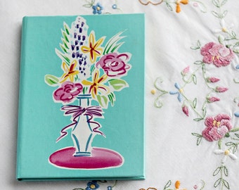 Phone address book, sea sky blue, green pink yellow, violet purple white, floral illustration, vase with flowers, Russ Berrie and Company