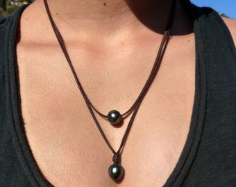 Tahitian pearls on australian leather necklace, two beautiful black pearls, lava bead at closure