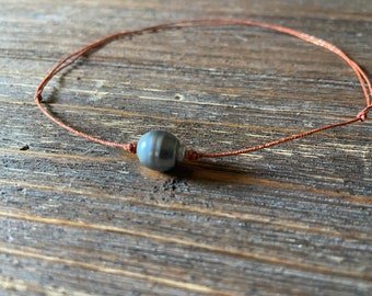 Tahitian pearl bracelet on japanese silk cord. Woman bracelet minimalist and shiny style.