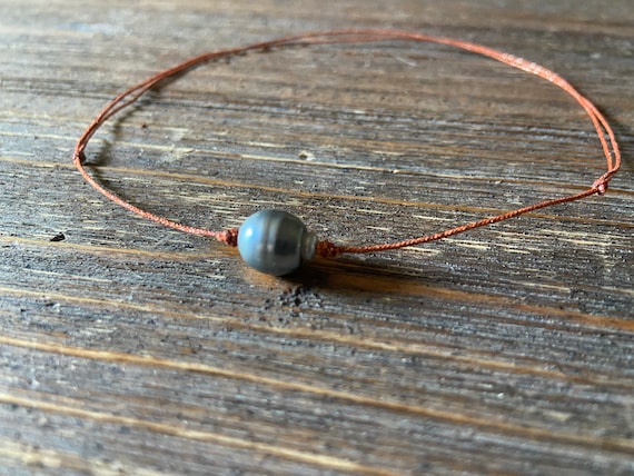 Tahitian pearl bracelet on japanese silk cord. Woman bracelet minimalist and shiny style.