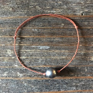 Tahitian pearl bracelet on japanese silk cord. Woman bracelet minimalist and shiny style. Orange