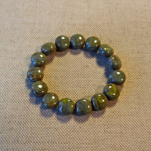 Round Czech 10MM Glass Puffed Coin, Lentil Beads In Variegated Light To Dark Mossy Greens, Sold In Lots Of 15 Pieces