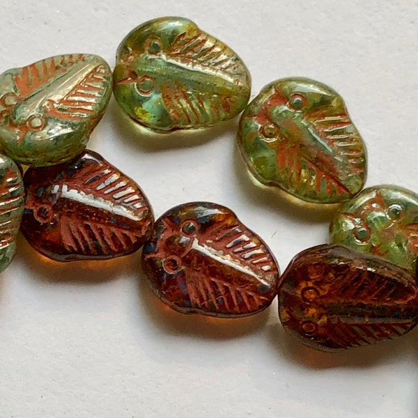 Czech Pressed Glass 13x11x4mm Trilobite Fossil Beads In Either Translucent Amber Or Sea Green With Rusty Red Picasso Finish In 10 Piece Lots