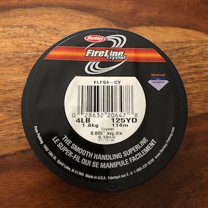 One 114 Meter Spool Of Berkeley FireLine 4LB Test Crystal .13 MM Thread