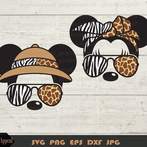 May include: A pair of cartoon mouse ears with safari-themed designs. The ears are black with a zebra and giraffe print on the inside. One ear has a safari hat with a zebra and giraffe print band. The other ear has a zebra and giraffe print bow. Both ears have sunglasses with zebra and giraffe print lenses.