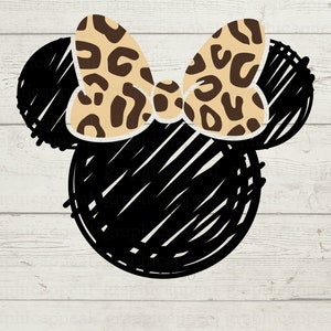 Puede incluir: Boceto en blanco y negro de orejas de Mickey Mouse con un lazo de estampado de leopardo marrón y beige.