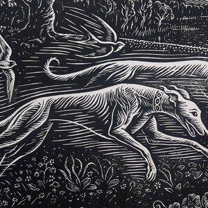 May include: Black and white woodcut print of two greyhounds running through a field of flowers. The dogs are in mid-stride, with their legs extended and their tails wagging. The background is a field of flowers, with a forest in the distance.