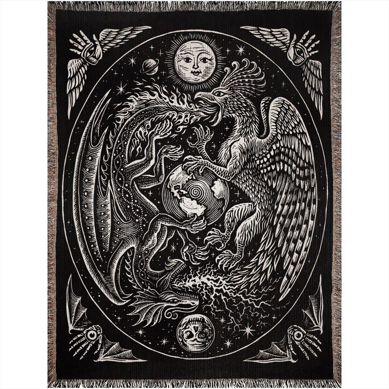 May include: Black and white woven tapestry featuring a dragon and a phoenix facing each other. The mythical creatures are surrounded by a circle of stars and a sun with a human face. The tapestry has a textured, woven look.
