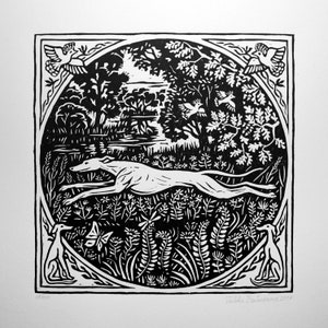 May include: Black and white woodcut print of a dog running through a forest. The dog is in the center of the image, and the forest is in the background. There are birds flying in the air, and the text "Valda Baiceros 2017" is in the bottom right corner.