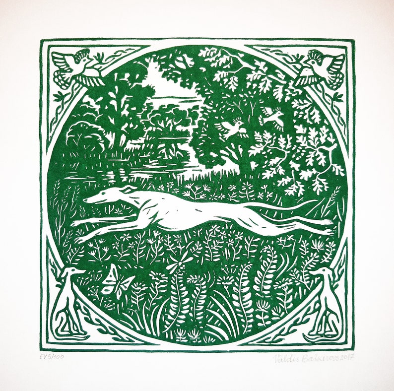 May include: A green and white woodblock print of a running dog in a forest setting. The dog is white and the forest is green with birds and other details. The print is signed "Valdis Erkenbrauns 2017" and numbered "17/200".