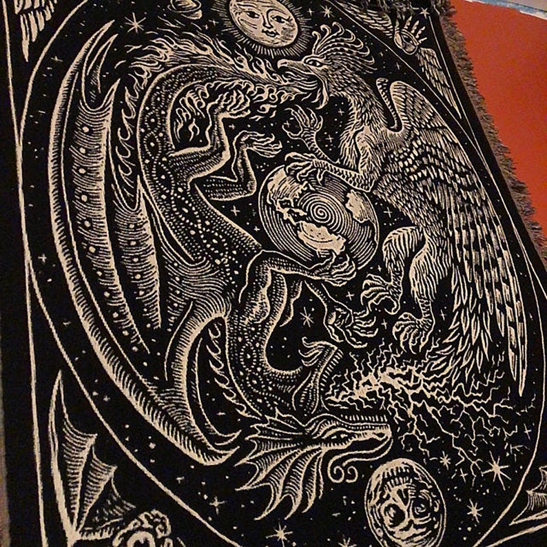 May include: A black tapestry with a white design of a dragon and a phoenix fighting over a globe. The background is a starry night sky with a sun and moon in the top corners.