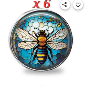 May include: A round, silver-toned button with a detailed bee design. The bee has a yellow and brown body with blue stripes and white wings. The background is a blue mosaic pattern. The text "x 6" is in red.