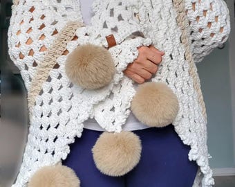 White and camel crochet wrap with fur ball accent.