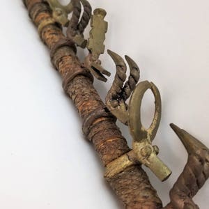 Early 20th Century Large African wooden pipe with brass animals and wrapped in snakeskin.