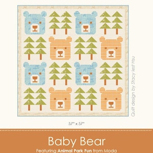 May include: A square quilt featuring a repeating pattern of blue and orange bear faces and green trees. The quilt measures 57" x 57". The design is called "Baby Bear" and is by Stacy Iest Hsu.
