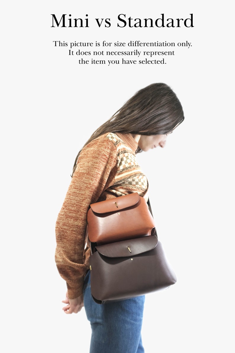 May include: Two leather handbags, one brown and one dark brown, are worn by a person. The text "Mini vs Standard" is at the top of the image. The text "This picture is for size differentiation only. It does not necessarily represent the item you have selected." is below the title.