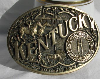 Duża, mosiężna, owalna klamra do paska „KENTUCKY”, ADM, pierwsze wydanie, wyścigi konne, Churchill Downs, pieczęć stanowa, zabytkowy dodatek z lat 70.