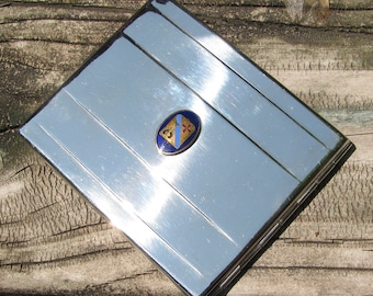 Vintage Art Deco Silver Metal  "Monos" Foil Stickered Hinged Cigarette Case, Guilloché Enameled Crest or Emblem, Great Condition, Smokes