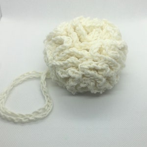 May include: White crocheted bath pouf with a long loop handle.