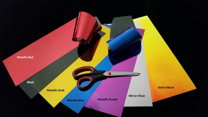 May include: Assortment of colored vinyl sheets for crafting, including metallic red, black, metallic gold, metallic blue, metallic purple, mirror silver, and gold iridium. A pair of scissors is also included.
