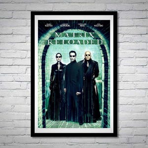 May include: A movie poster for the film "The Matrix Reloaded" featuring Keanu Reeves, Laurence Fishburne, Carrie-Anne Moss, and Jada Pinkett Smith. The poster is black and white with a green background.