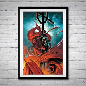 May include: A framed comic book cover featuring a red and black superhero character with a cape and chains, standing on a cross-shaped structure. The background is a dark blue sky with clouds.