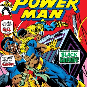 May include: Comic book cover featuring Luke Cage, Power Man, in a blue and yellow costume, fighting a large, muscular man in a black costume. The text on the cover reads "Luke Cage, Power Man" and "Black Goliath".