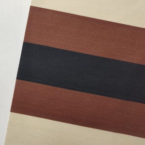 May include: A textile fabric featuring a repeating horizontal striped pattern. The design consists of wide bands in cream, followed by a broad stripe of reddish-brown, a central stripe of dark charcoal black, and another reddish-brown band.