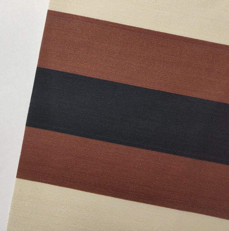 May include: A textile fabric featuring a repeating horizontal striped pattern. The design consists of wide bands in cream, followed by a broad stripe of reddish-brown, a central stripe of dark charcoal black, and another reddish-brown band.