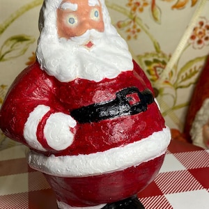 May include: A set of three ceramic nesting bowls in graduating sizes. The bowls feature a speckled, off-white glaze with a slightly textured surface. The largest bowl is approximately 8 inches in diameter.