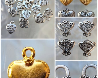 Set of heart-shaped pendants in metal or resin