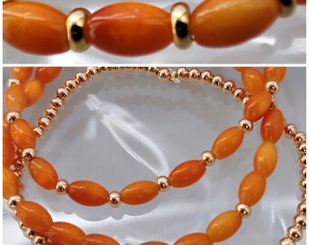 Set of 3 orange bracelets with gold-plated beads