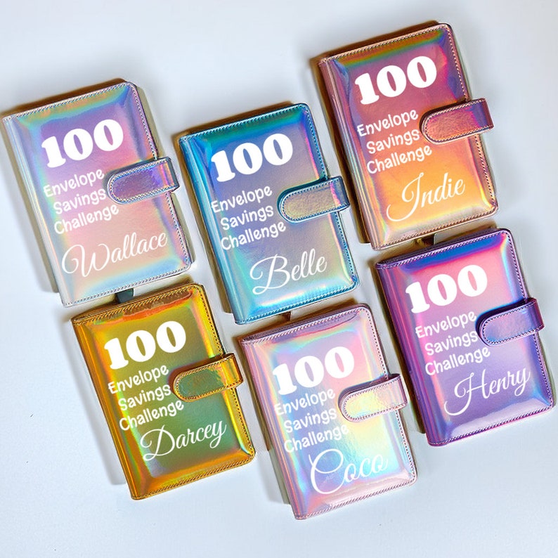 May include: Six iridescent holographic notebooks with the text "100 Envelope Savings Challenge" and a personalized name on each. The notebooks are in various colors, including pink, blue, purple, and gold.