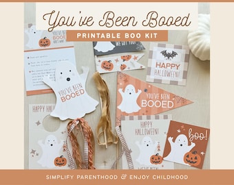 May include: Printable Halloween "You've Been Booed" kit with ghost and pumpkin illustrations. Includes a door hanger, a banner, a sign, and a ghost with a "You've Been Booed" message.