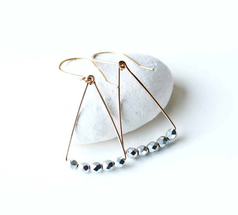 Jewelry trends 2021 Spring gift ideas. Minimalist geometric earrings gold filled and silver triangle shape in mixed metal earrings
