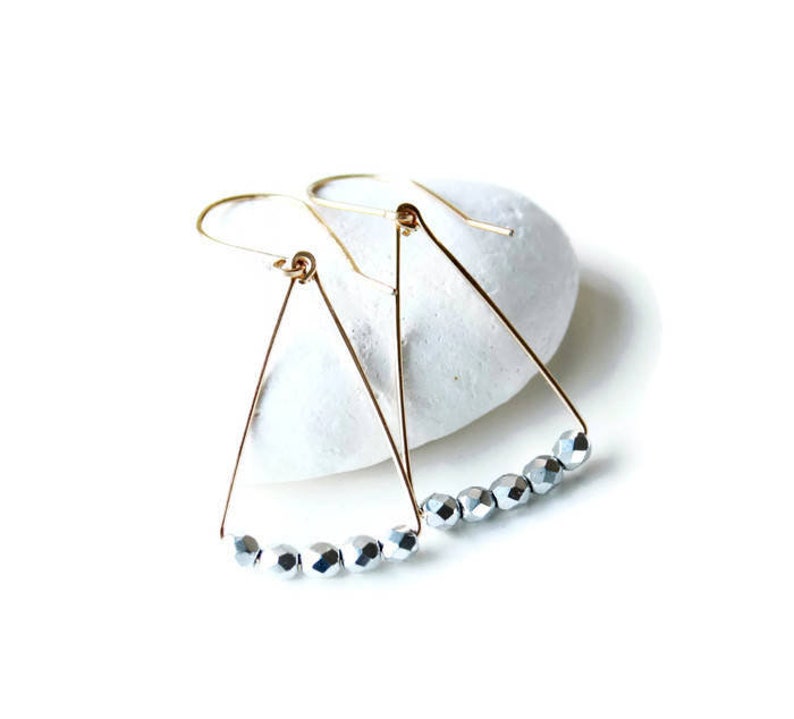 Jewelry trends 2021 Spring gift ideas. Minimalist geometric earrings gold filled and silver triangle shape in mixed metal earrings