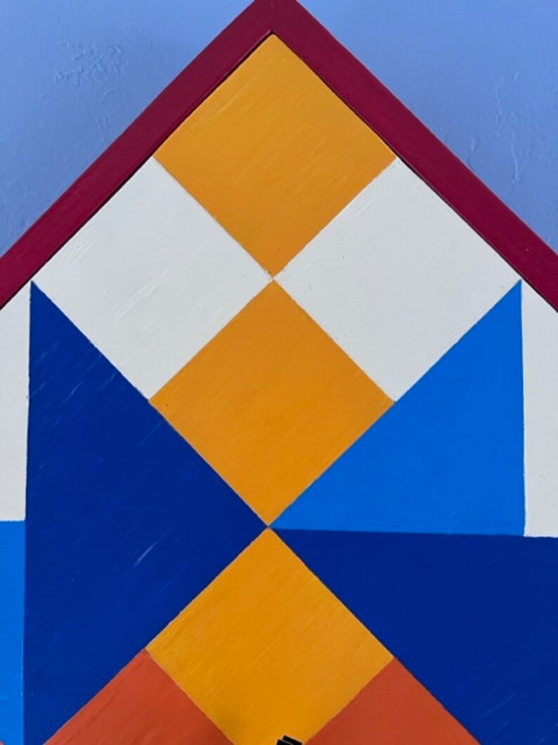 Detail of hand painted Barn Quilt clock.