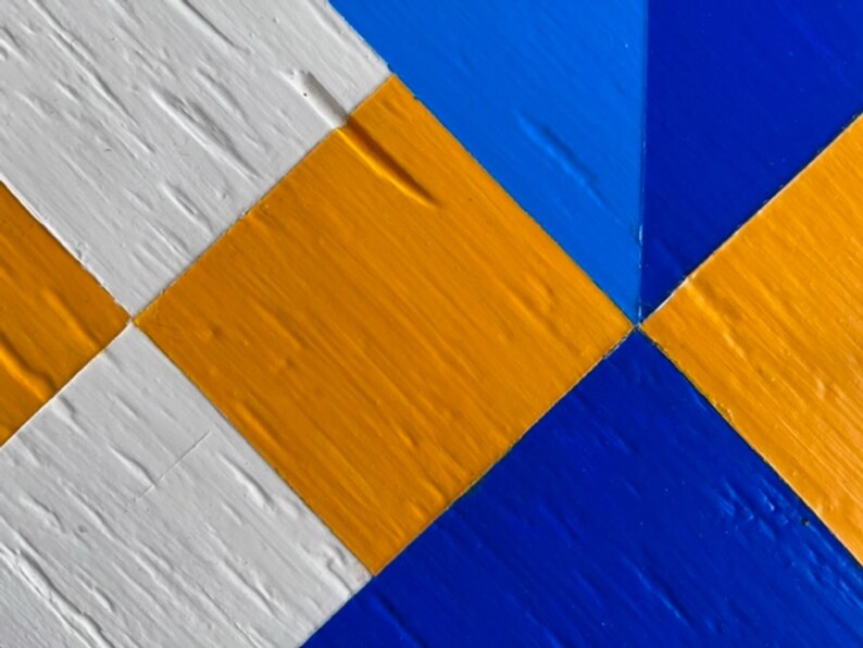 Detail of hand painted Barn Quilt clock.