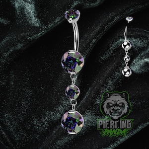 Piercing de umbigo redondo com gema grande pendente em titânio ASTM F136, cor AB escuro, grau implante, rosca interna e cravação em garras.