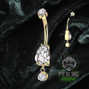 Piercing de umbigo duplo redondo em titânio 14g com gema em formato de pera, grau implante, rosca interna e engaste em bisel. Banhado a ouro PVD.