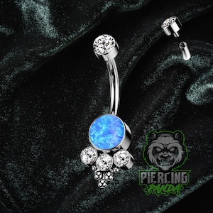 Piercing de umbigo em titânio 14g ASTM F136 com cluster de opala azul, grau implante, rosca interna e cravação dupla redonda.