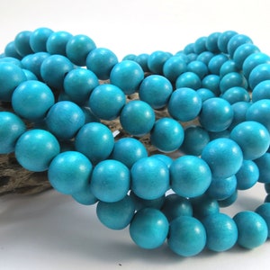 Perline di legno blu turchese da 12 mm, due (2) fili da 16 pollici, articolo 1042wb