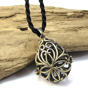 Teardrop Cage Pendant, 30.5x22mm Teardrop Cage with Cutout Design & Safety Latch, 2.3mm-2.6mm Satin-Finished Black Nylon Necklace, Item 1867
